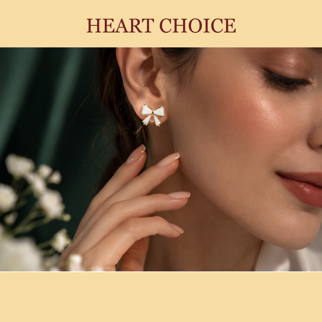 Woman wearing elegant white enamel bow stud earrings with gold finish.