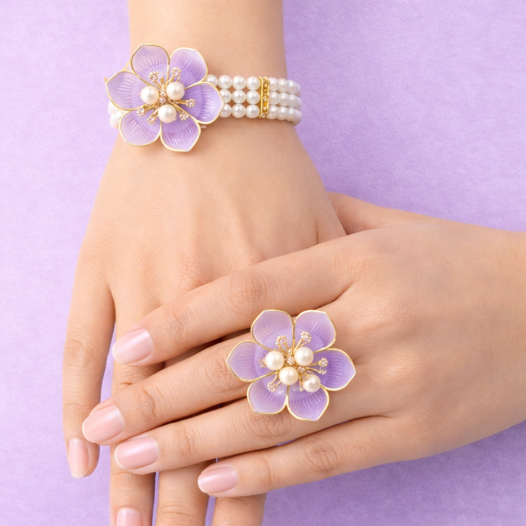 Elegant purple floral bracelet with pearls and gold accents