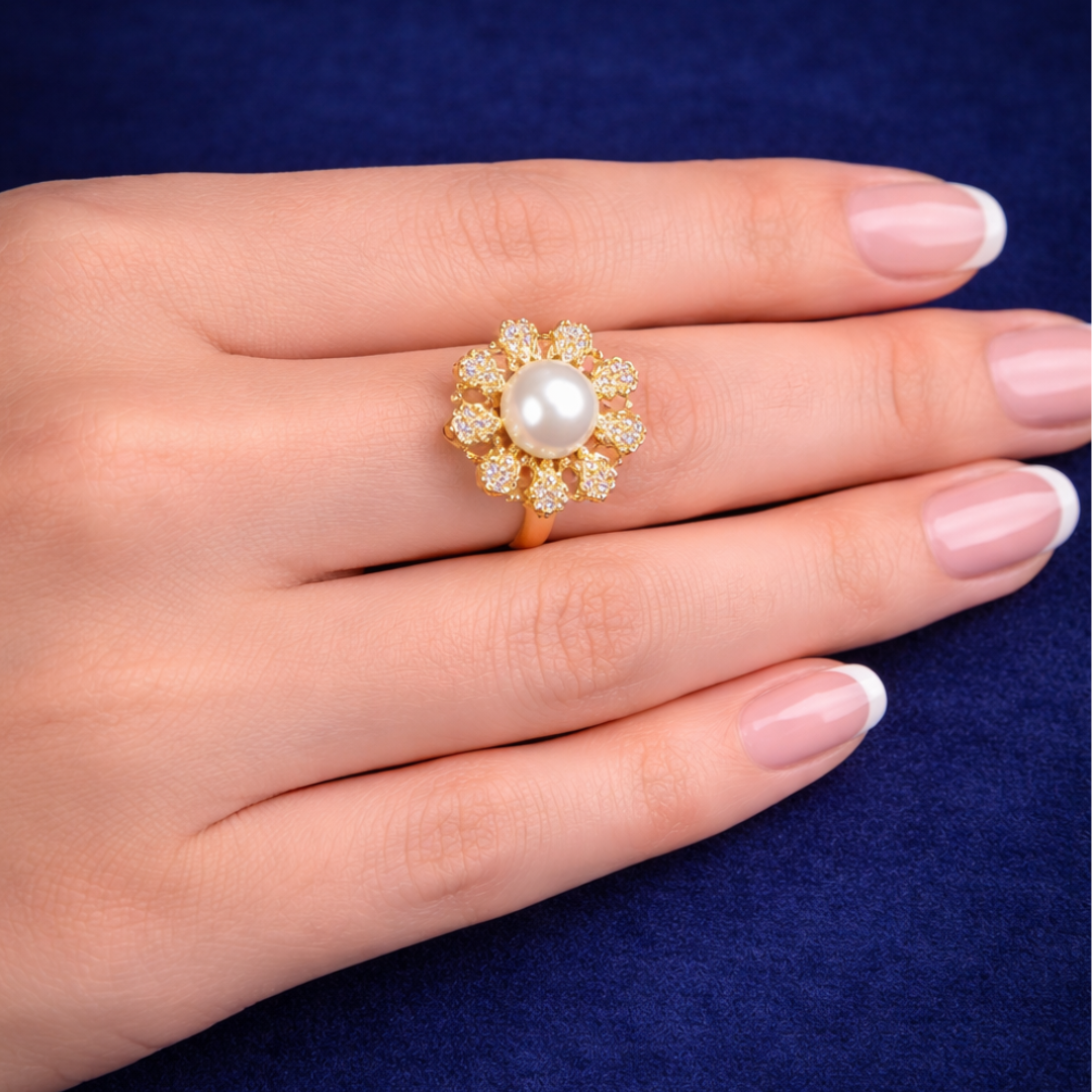 Elegant pearl flower ring with gold plating and crystal stones on hand